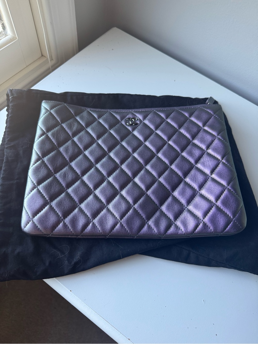 CHANEL New without tags. Iridescent Purple Quilted Lambskin Clutch